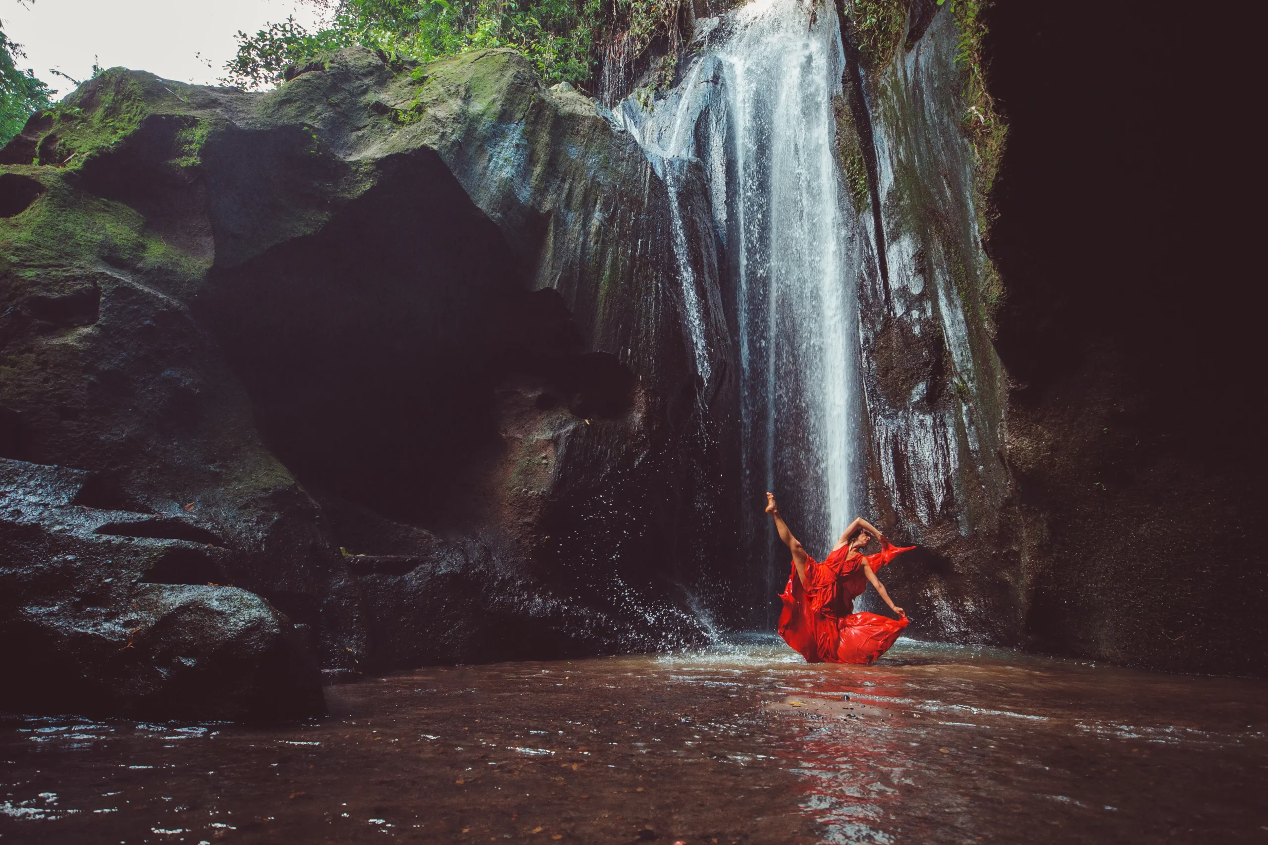 girl-red-dress-dancing-waterfall